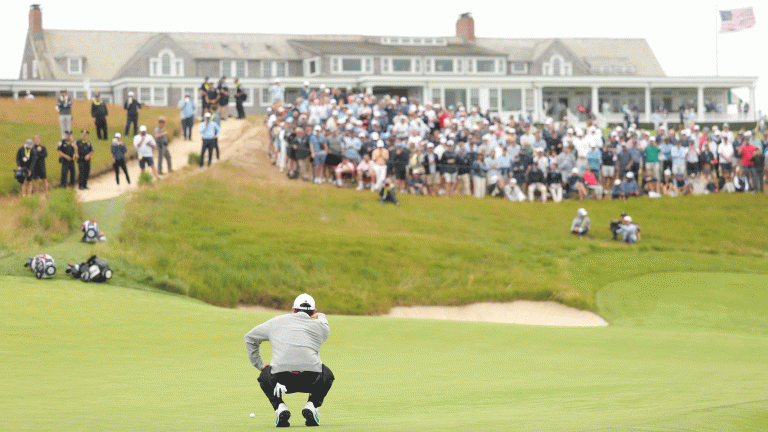 Rory McIlroy lines up a putt on the 18th green at Shinnecock Hills during round one of the 2026 US Open