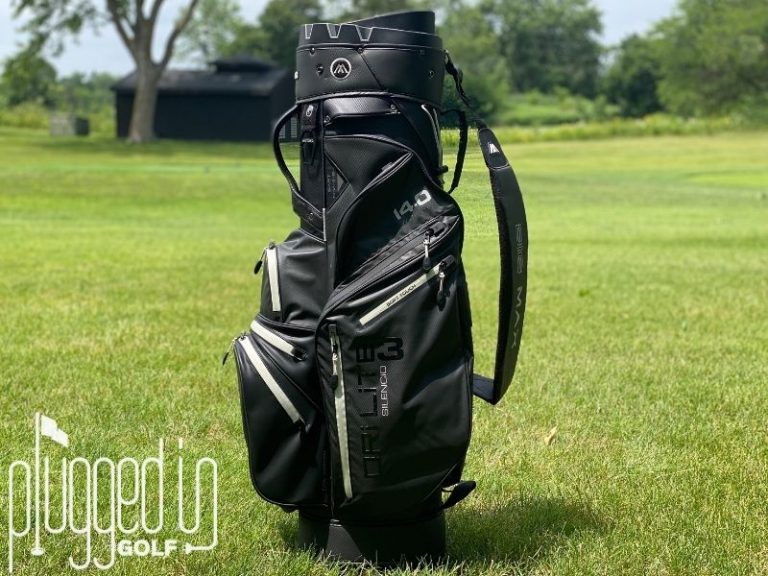 BIG MAX Dri Lite Silencio 3 Cart Bag Review Picture of the BIG MAX Dri Lite Silencio 3 standing vertically in front of a fairway.